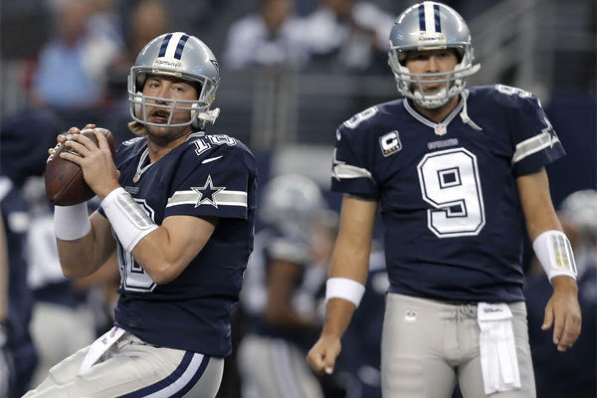 Dallas quarterbacks Kyle Orton, left, and Tony Romo warm up before the Cowboys' game against Oakland on Nov. 28.