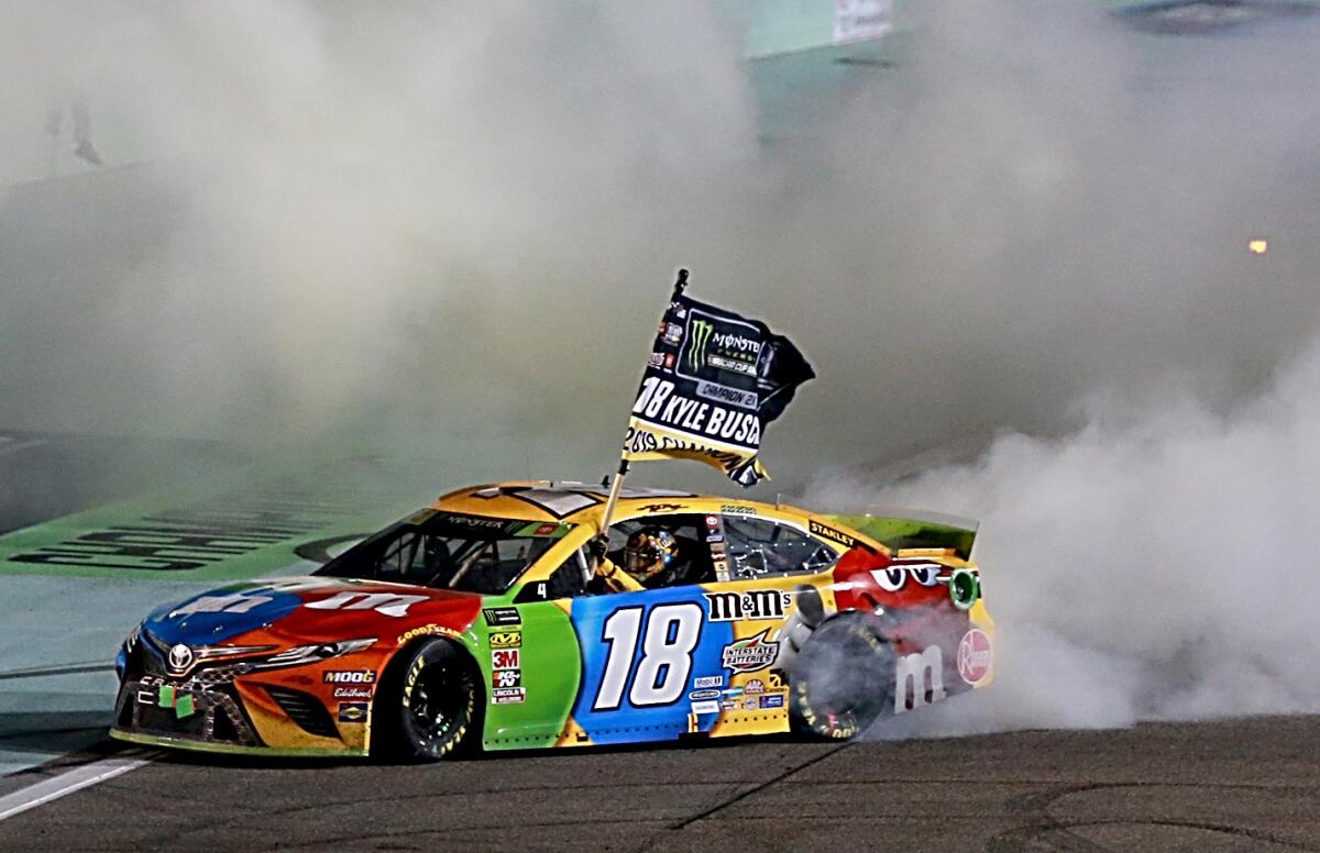 Kyle Busch celebrates with a burnout after winning the NASCAR Cup season title Sunday.