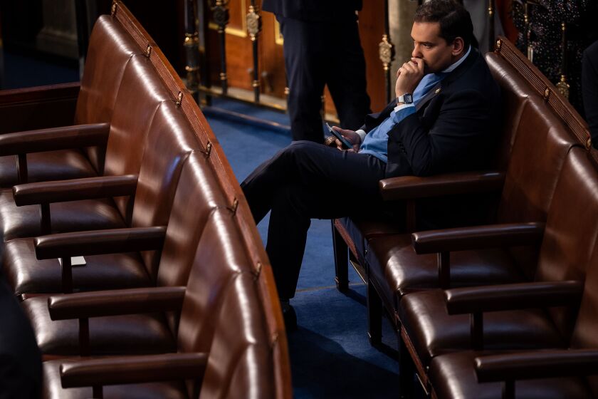 WASHINGTON, DC - JANUARY 03: Rep.-elect George Santos (R-NY) sits in the House Chamber of the U.S. Capitol Building following the first ballot for Speaker of the House on Tuesday, Jan. 3, 2023 in Washington, DC. Today members of the 118th Congress will be sworn in and the House of Representatives will hold votes on a new Speaker of the House. (Kent Nishimura / Los Angeles Times)