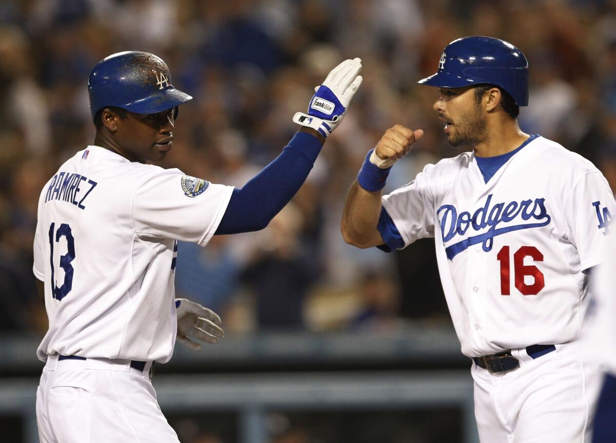 Despite their respective injuries, Dodgers shortstop Hanley Ramirez, left, and center fielder Andre Ethier will be back in the lineup for Game 4 of the NLCS on Tuesday.