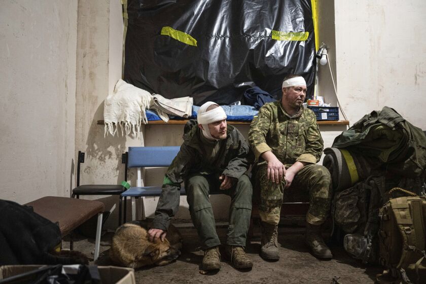 Ukrainian servicemen who were wounded at the battlefield wait to leave the field hospital near Bakhmut, Ukraine, Sunday, Feb. 26, 2023. (AP Photo/Evgeniy Maloletka)