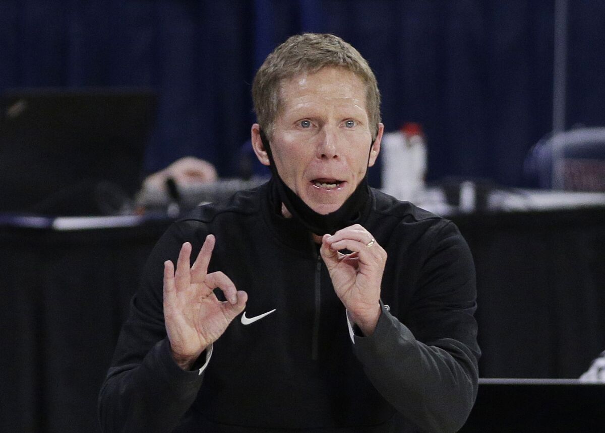 FILE - In this Feb. 25, 2021, file photo, Gonzaga coach Mark Few signals to players during the second half of an NCAA college basketball game against Santa Clara in Spokane, Wash. Few has been cited for driving under the influence. The Coeur d’Alene Press and Spokesman-Review acquired a police report through a public information request that says Few was stopped Monday evening, Sept. 6, after he was “called in as driving erratic and speeding.” (AP Photo/Young Kwak, File)