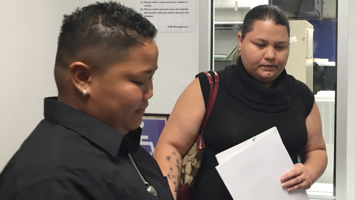 Loretta M. Pangelinan, left, and Kathleen M. Aguero, both 28, react after they were turned away while attempting to apply for a marriage license in Guam in April. On Wednesday, Guam's attorney general declared gay marriage legal in the U.S. territory.