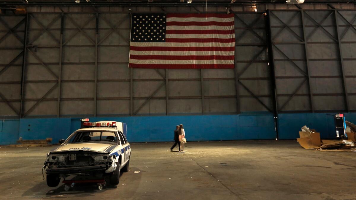A badly damaged Port Authority squad car is one of the last Sept. 11 artifacts left at Hangar 17.