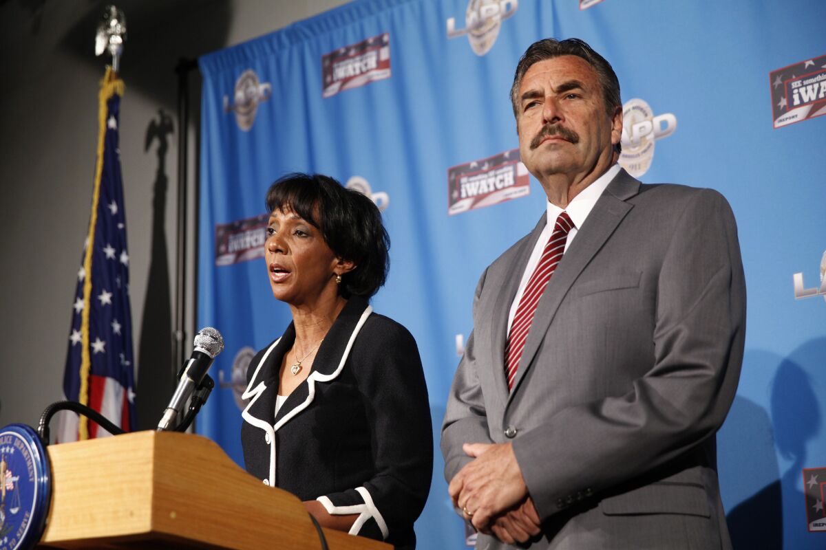 L.A. police Chief Charlie Beck at a 2014 news conference with Los Angeles County Dist. Atty. Jackie Lacey. Beck has asked Lacey to file charges against an LAPD officer who killed an unarmed man in Venice last year.