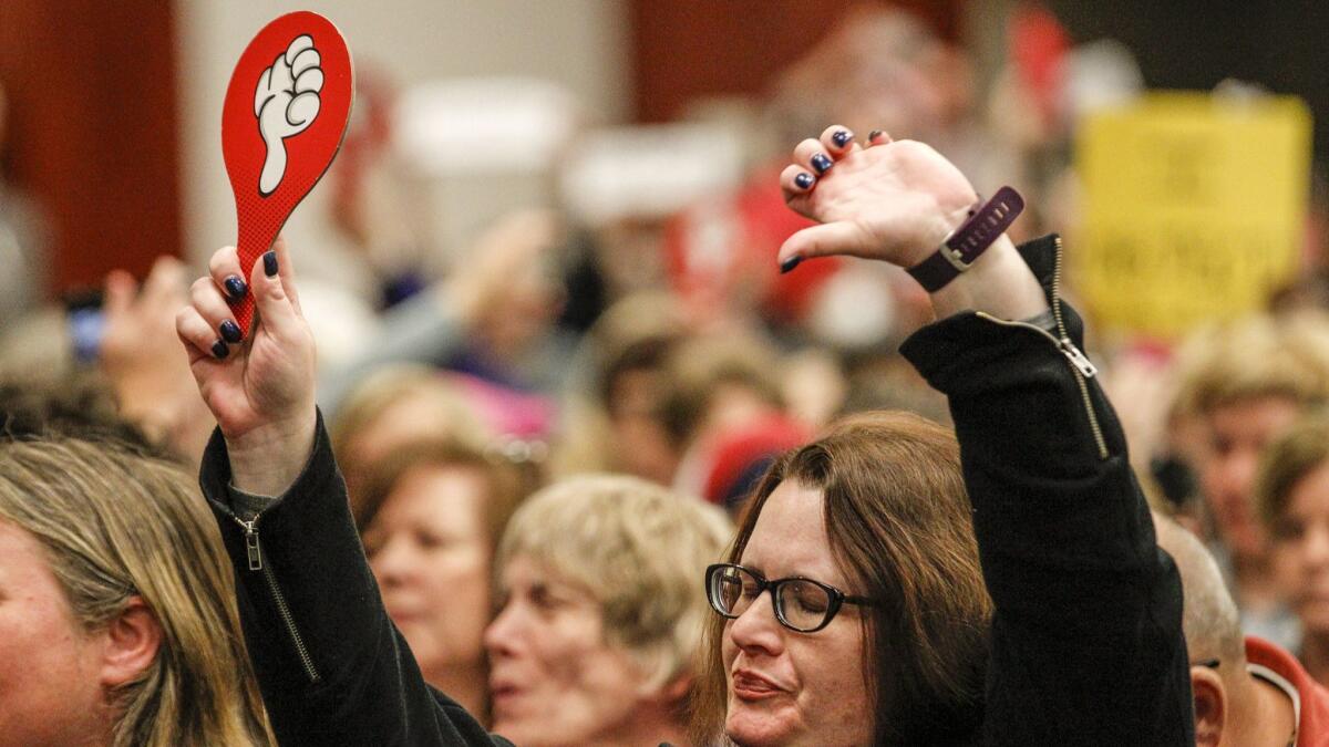 Kathleen Walker responds to a statement made by Rep. Steve Knight during a town hall meeting in Palmdale.