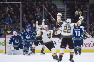 Vegas Golden Knights defenseman Nick Holden (22) celebrates his goal against the Vancouver Canucks during the second period of an NHL hockey game Thursday, Dec. 19, 2019, in Vancouver, British Columbia. (Jonathan Hayward/The Canadian Press via AP)