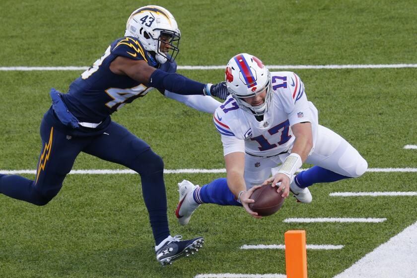 Buffalo Bills quarterback Josh Allen (17) scores a touchdown on a run against Los Angeles Chargers.