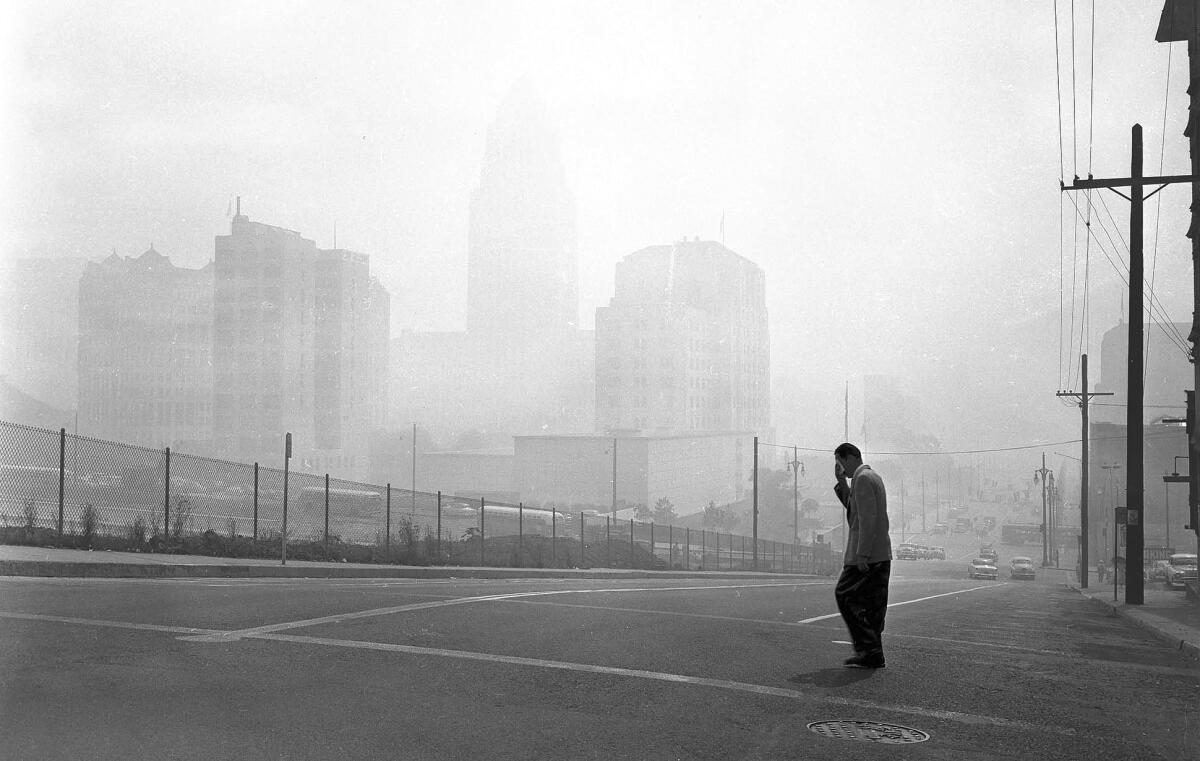 L.A. buildings are barely visible looking east at 1st and Olive streets at 11 a.m. Sept. 13, 1955, when smog was at its peak.