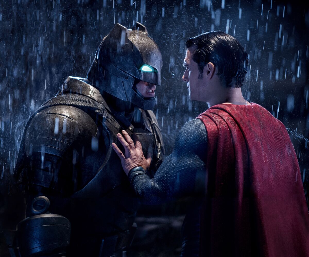 Ben Affleck as Batman, left, and Henry Cavill as Superman in a scene from "Batman V. Superman: Dawn Of Justice."