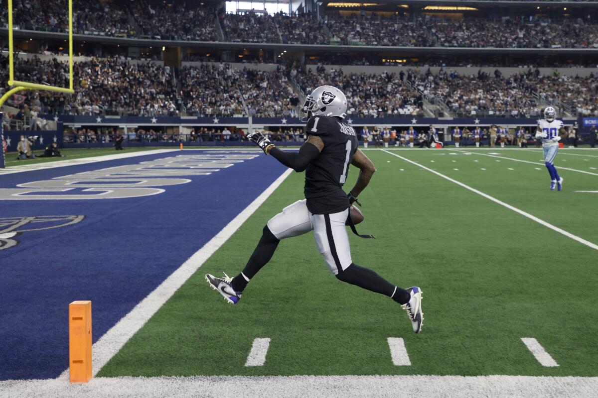 FILE - Las Vegas Raiders wide receiver Hunter Renfrow (13) runs the ball  against the Kansas City Chiefs during the first half of an NFL football game  Jan. 7, 2023, in Las