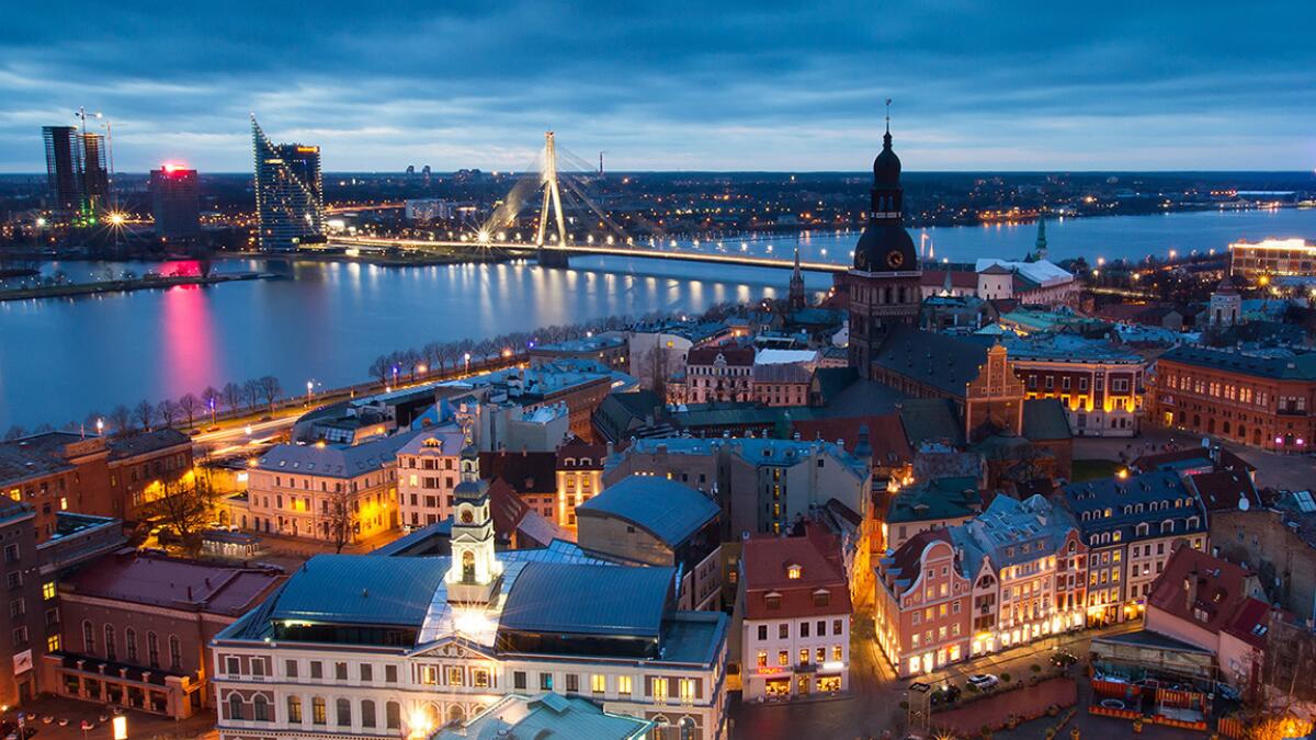 Sunset over the old town of Riga, Latvia. Lot Polish Airlines is offering a round-trip fare for spring or summer travel for less than $700.