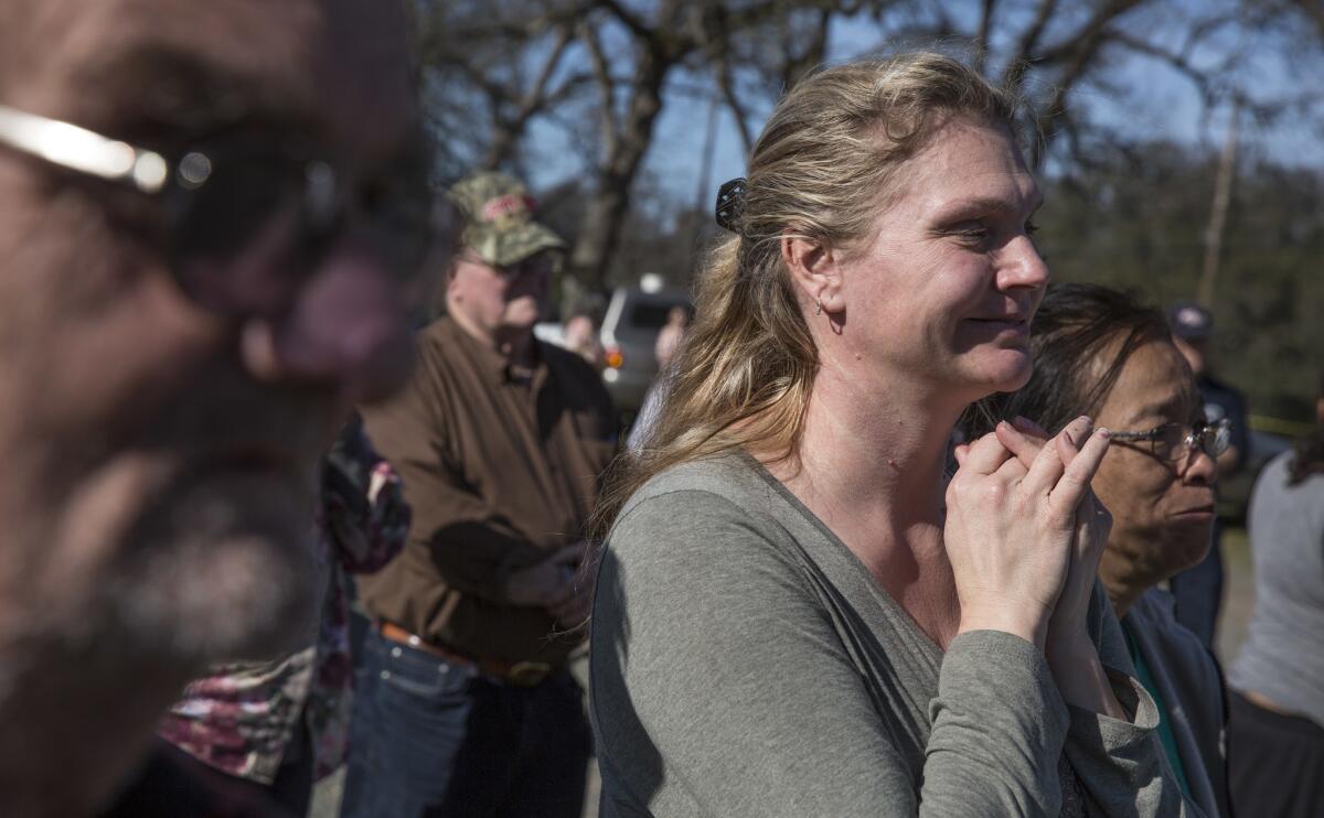 Evacuees at the Bangor Community Hall in Bangor, Calif., listen to Butte County sheriff's deputies in February as the mandatory evacuation order was lifted. An evacuation advisory was lifted Wednesday.