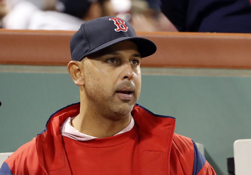 Boston Red Sox manager Alex Cora in the dugout during the fifth inning of a baseball game against the Toronto Blue Jays on April 11, 2019 in Boston.