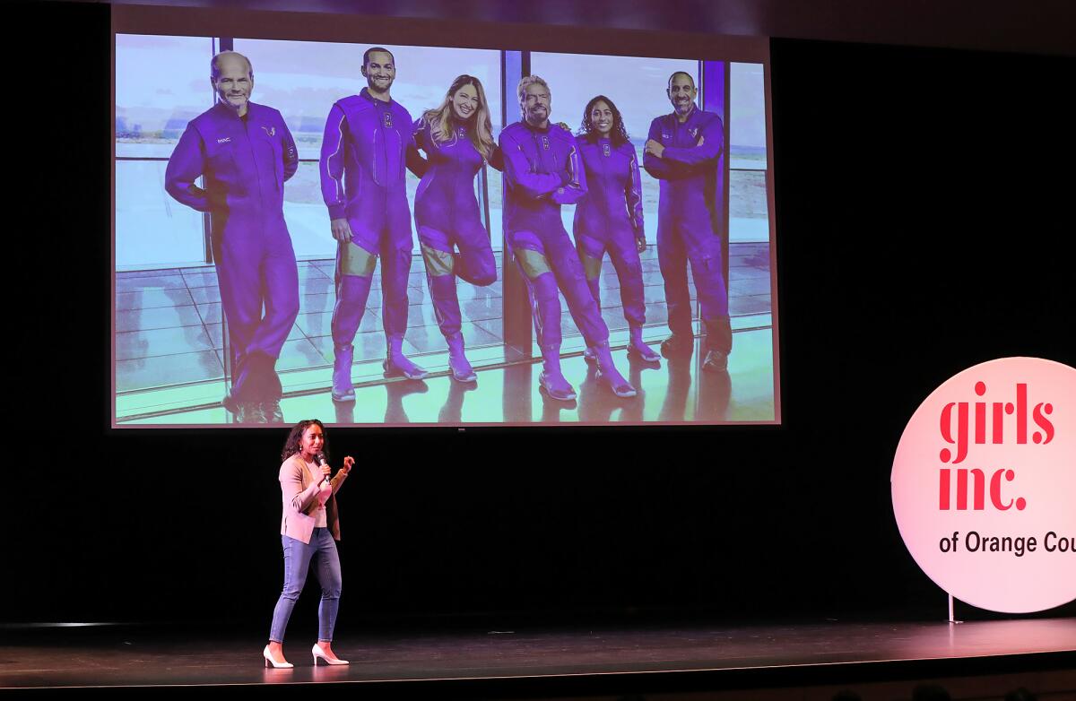 Sirisha Bandla shows the crew she launched into space with on Virgin Galactic's Unity 22 mission.