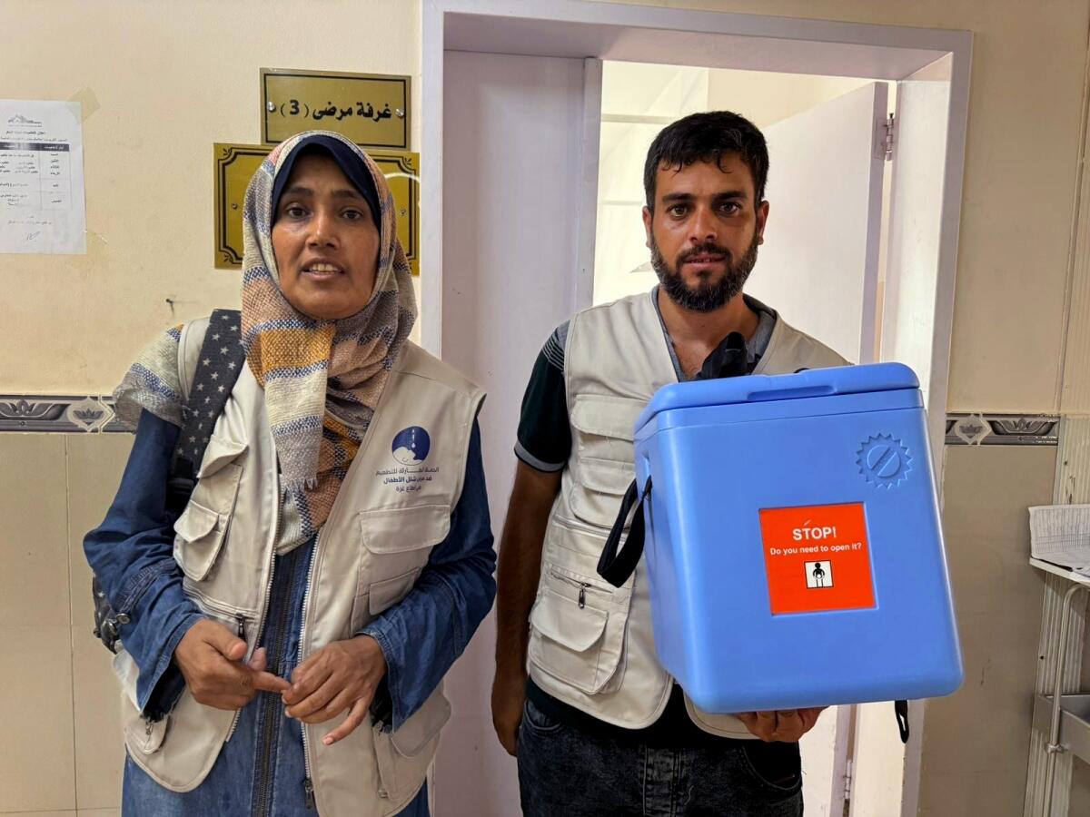 Nurses assisting with vaccination efforts in central Gaza, preparing to travel to a vaccination site. 