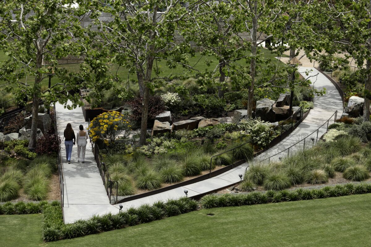 Visitors make their way through the Central Garden at the Getty Center.