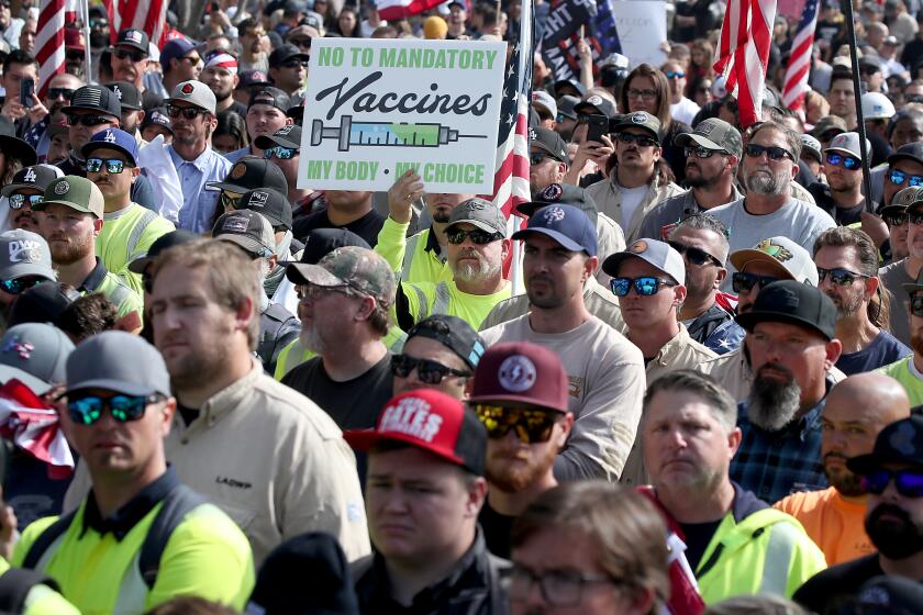 LOS ANGELES, CALIF. - NOV. 8, 2021. Hundreds of people opposed to vaccination madates protest at Grand Park in downtown Los Angeles on Monday, Nov. 8, 2021. Firefighters 4 Freedom hosted the "March for Freedom" rally in support of workers affected by the vaccine mandates in Los Angeles. (Luis Sinco / Los Angeles Times)