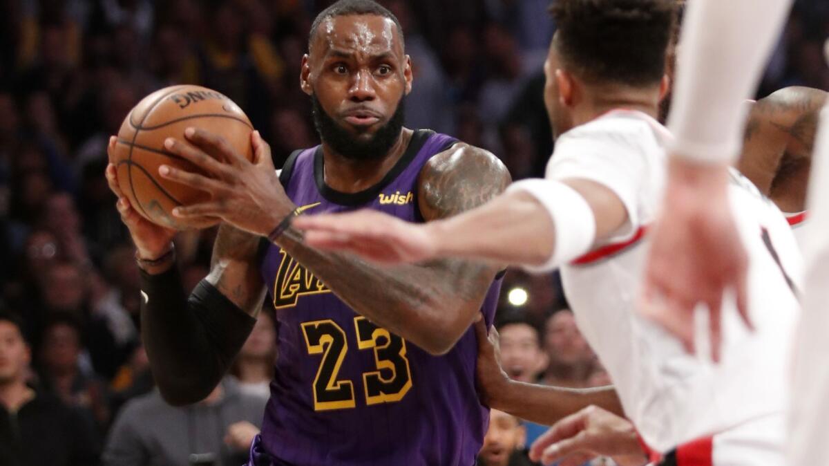 Lakers forward LeBron James looks for a way to the basket against the Portland Trail Blazers in the third quarter on Wednesday at Staples Center.