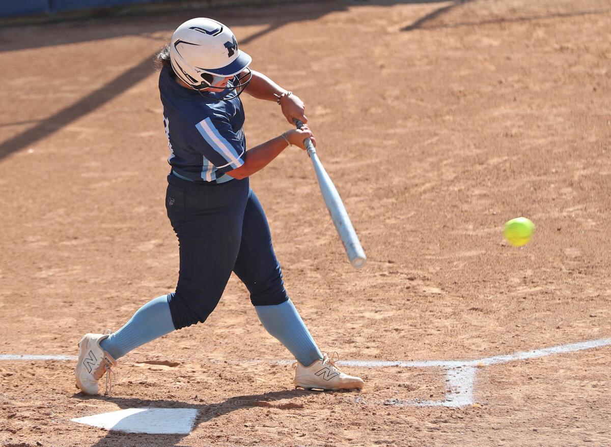 Marina's Gabby DiBenedetto (11) hits a single against Westlake on Friday.