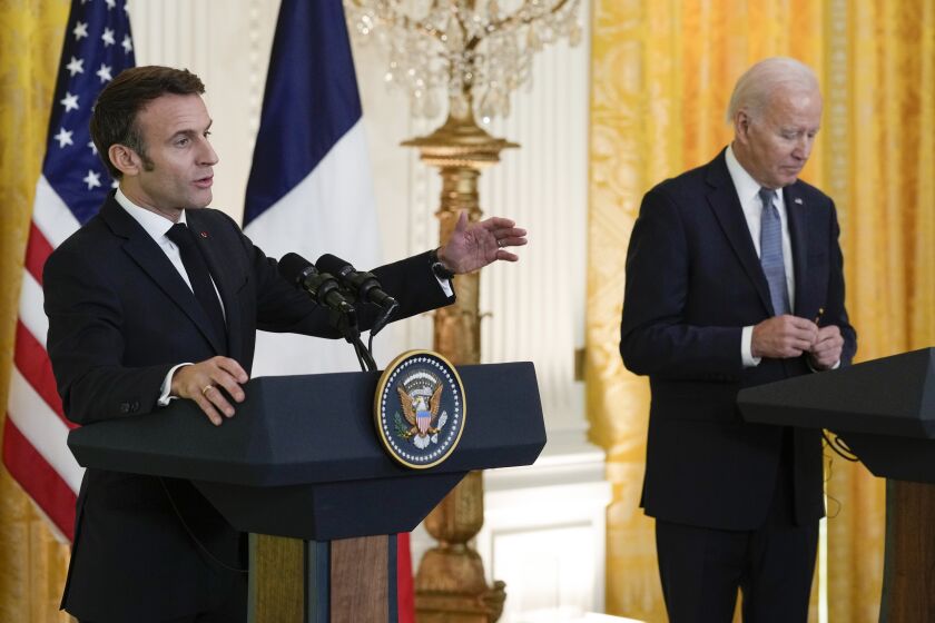 French President Emmanuel Macron speaks during a news conference with President Joe Biden in the East Room of the White House in Washington, Thursday, Dec. 1, 2022. (AP Photo/Susan Walsh)
