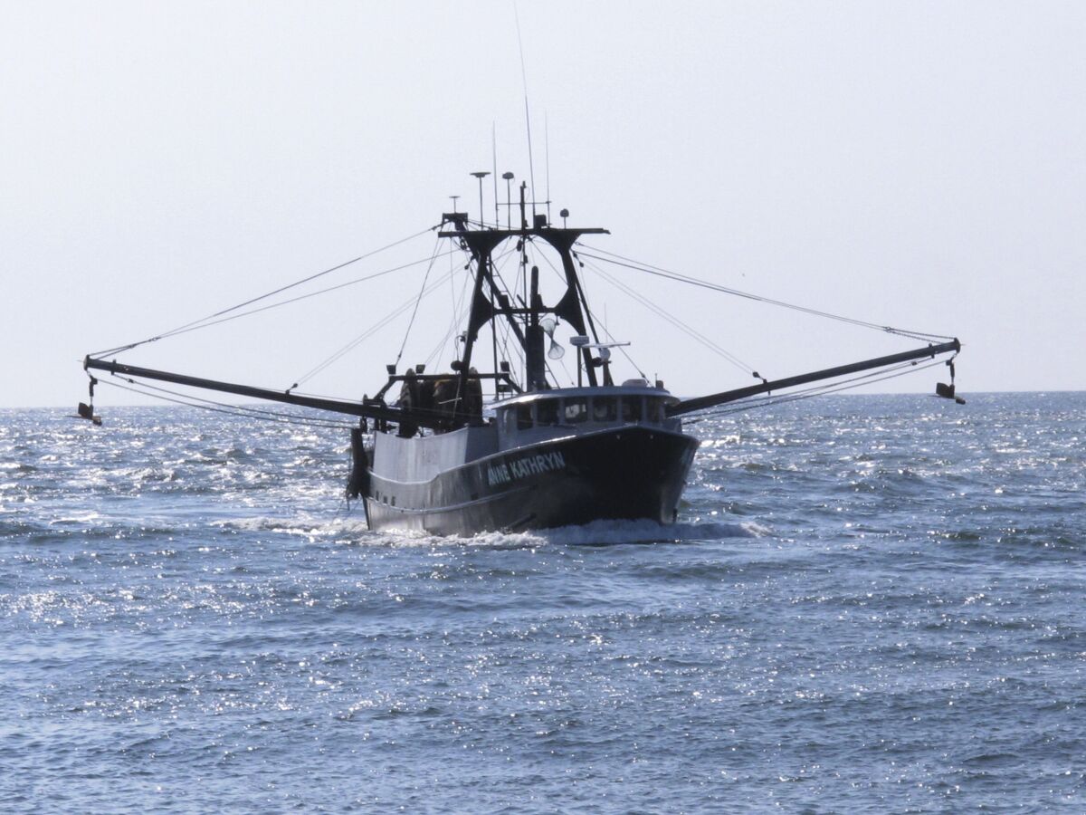 A fishing boat enters the Manasquan Inlet in Manasquan N.J. on Sept. 11, 2019 after returning from the ocean. A report issued March 29, 2023 by two federal marine science agencies and the commercial fishing industry highlighted several potential negative aspects of offshore wind energy development on the fishing industry and called for additional research. (AP Photo/Wayne Parry)