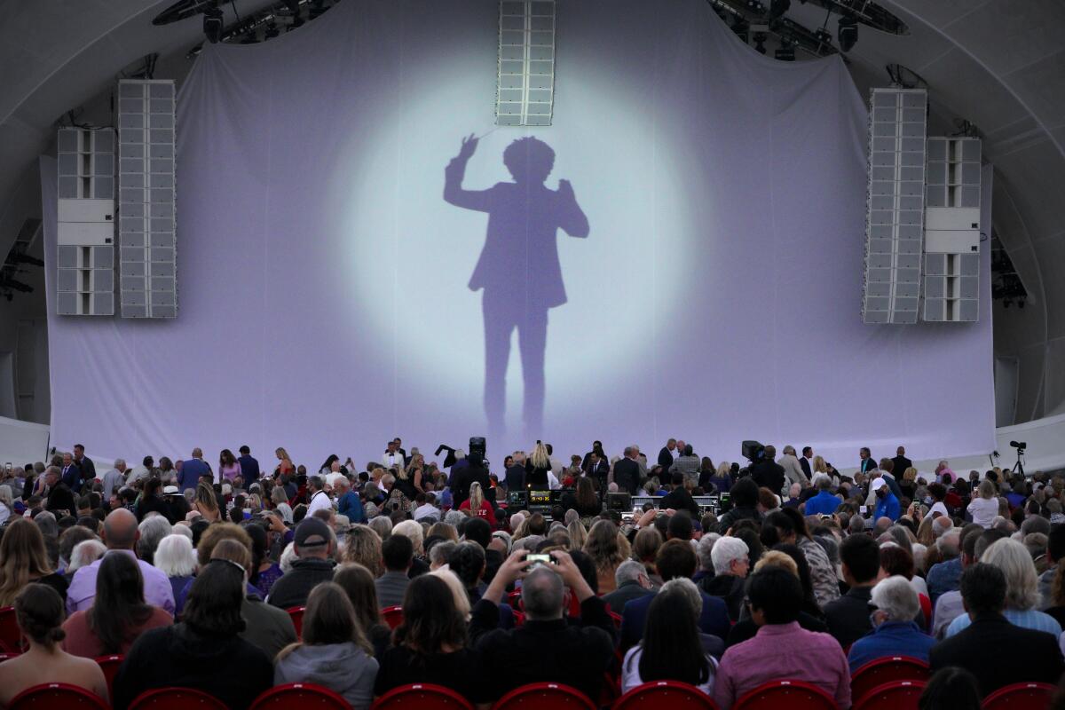 A silhouette of Rafael Payare was projected on the stage