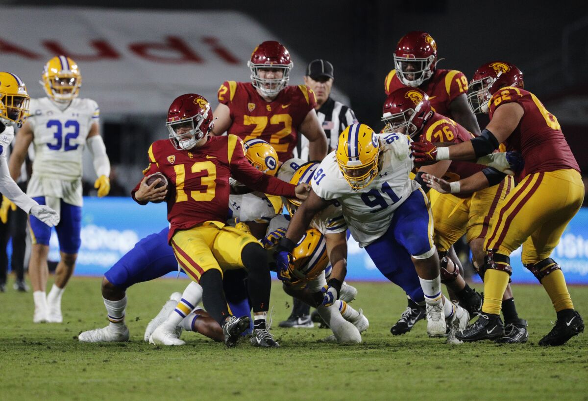 USC quarterback Caleb Williams runs the ball late in the fourth quarter to secure the Trojans' 41-35 victory Saturday.
