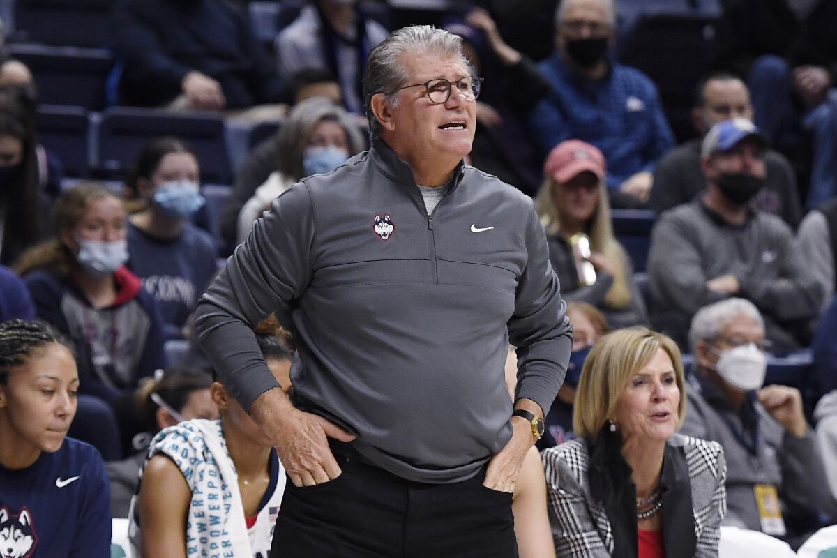 Connecticut head coach Geno Auriemma calls out to his team in the first half of an NCAA college basketball game against Creighton, Sunday, Jan. 9, 2022, in Storrs, Conn. (AP Photo/Jessica Hill)
