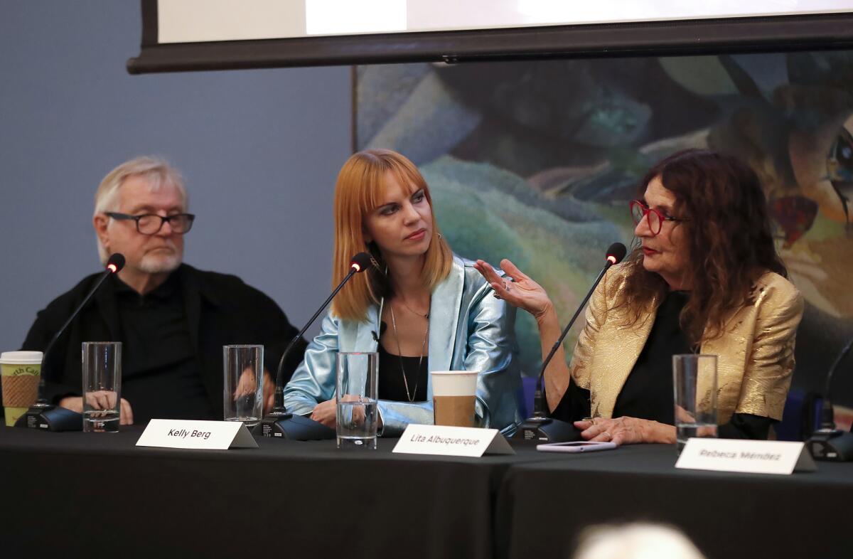 Laddie John Dill, Kelly Berg, and Lita Albuquerque, from left, participate in a panel about the Art & Nature Festival.