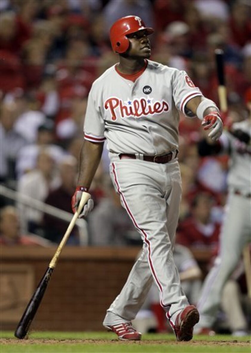 Philadelphia Phillies' Ryan Howard watches the ball fly out of the park for a grand slam during the fifth inning of a baseball game against the St. Louis Cardinals Monday, May 4, 2009, in St. Louis. (AP Photo/Jeff Roberson)