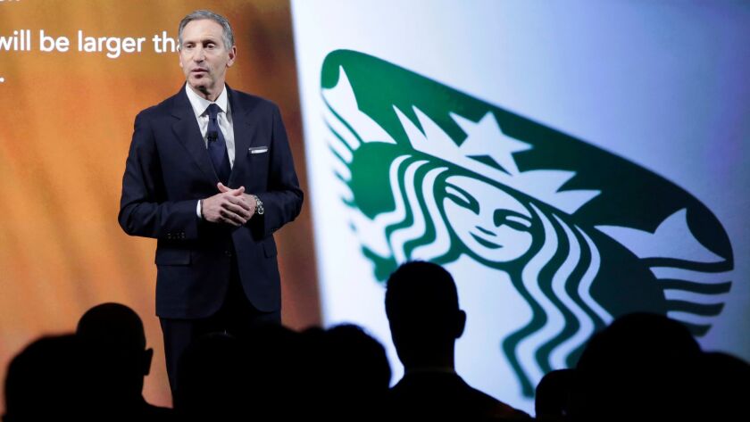 Starbucks Chairman and CEO Howard Schultz presents during an investor meeting in New York on Dec. 7. Schultz said in a letter that the company is planning to hire 10,000 refugees.