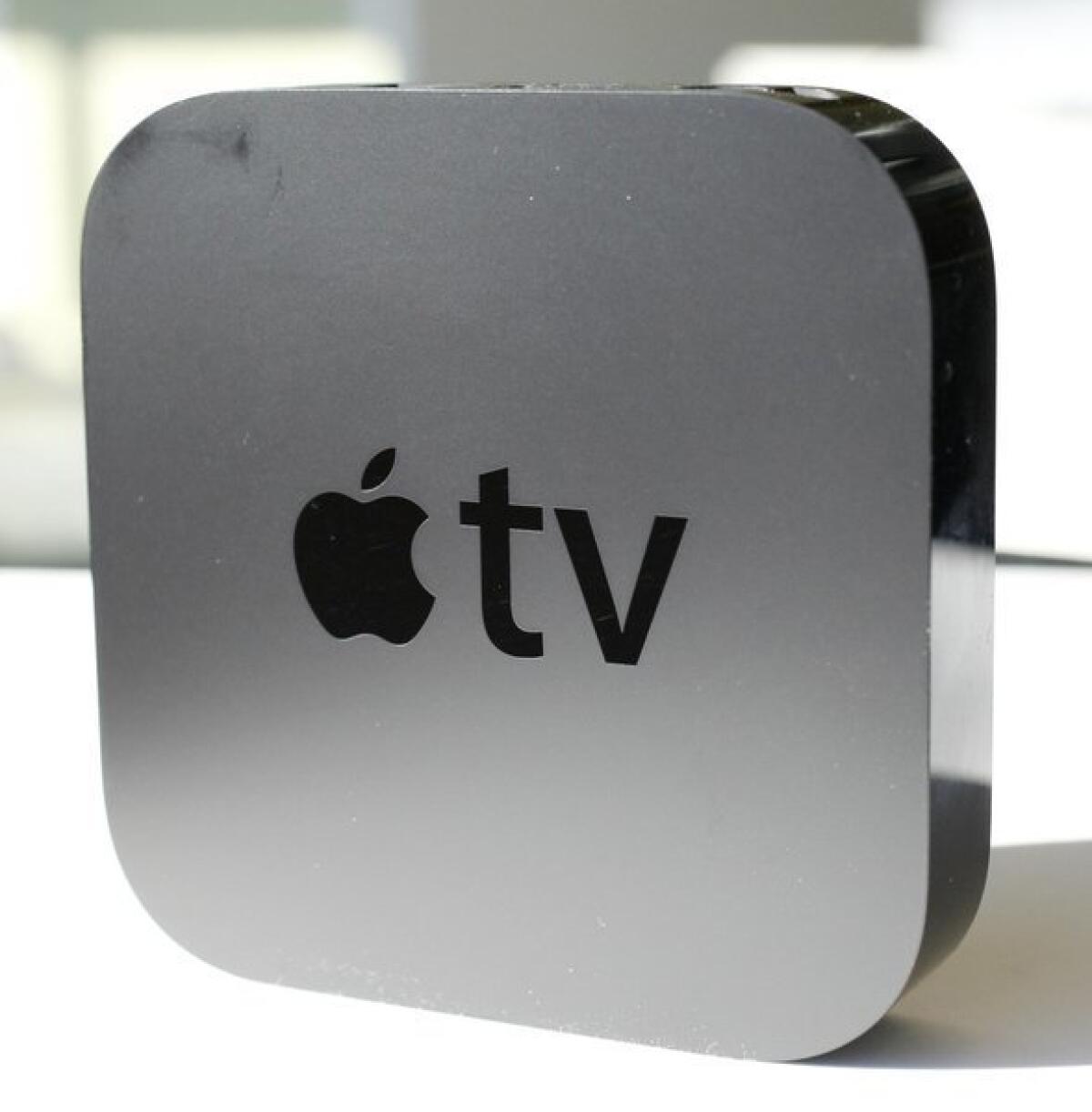 Apple CEO Tim Cook hints that the company plans to make its own TV set. The firm currently sells its Apple TV device, above, which connects to a TV.