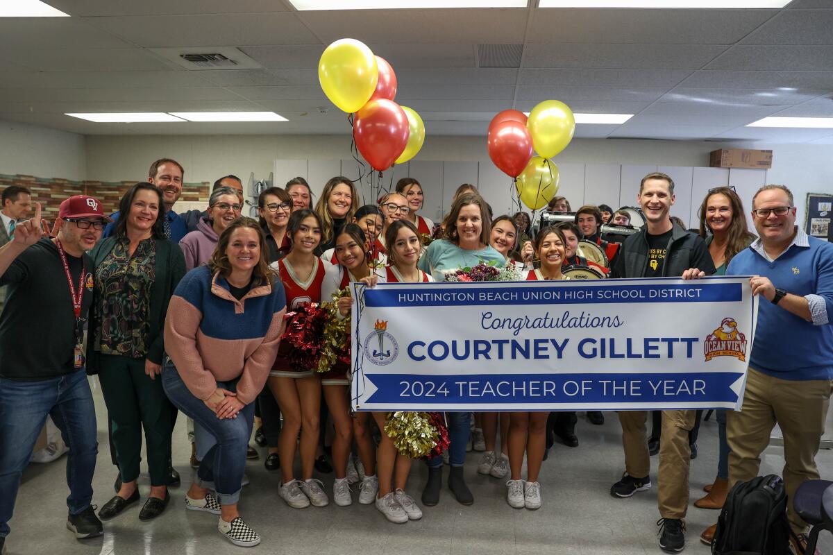 Courtney Gillett, center, was named one of the Huntington Beach Union High School District's 2024 Teachers of the Year.