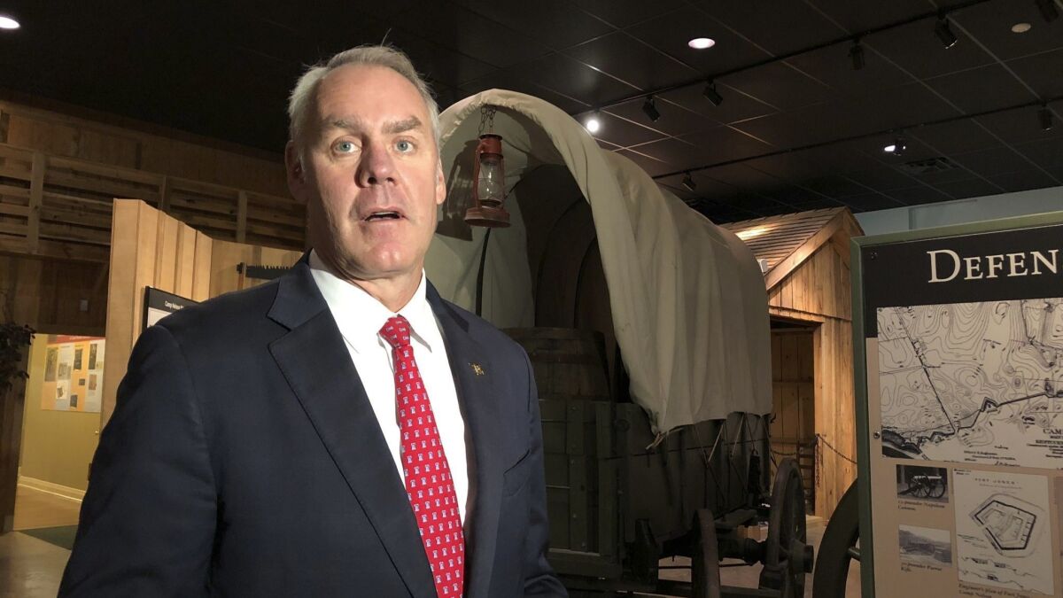 Interior Secretary Ryan Zinke speaks to reporters at the dedication of the Camp Nelson National Monument in Nicholasville, Ky., on Saturday.