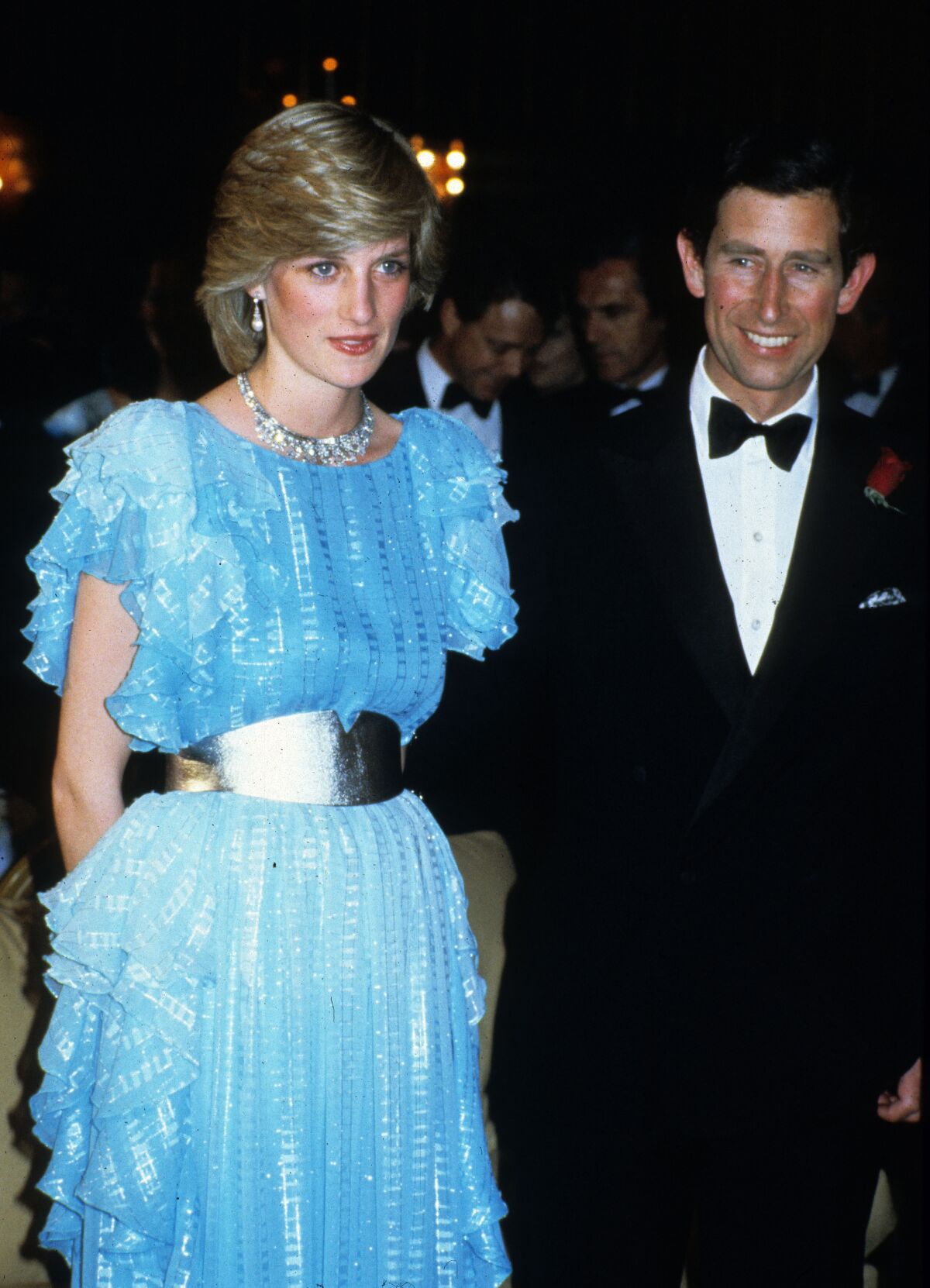March 1983: Princess Diana with Prince of Wales. A shimmery blue dress by Bruce Oldfield reflects her growing fashion sense.