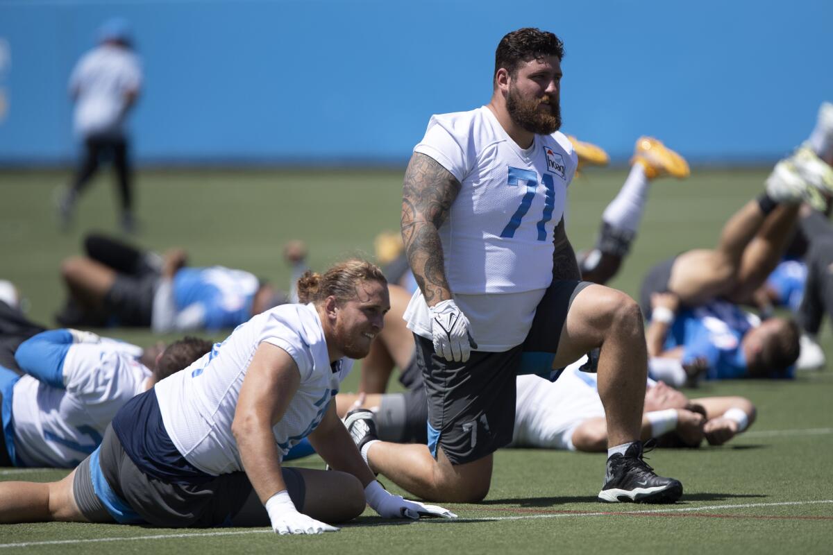 Chargers offensive tackle Storm Norton, left, and offensive guard Matt Feiler take part in minicamp drills on June 1.