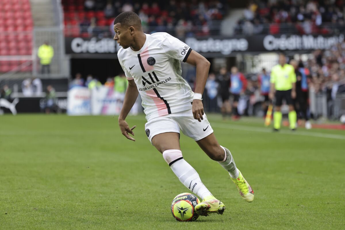 PSG's Kylian Mbappe is in action during the French League One soccer match between Rennes and Paris Saint-Germain at the Roazhon Park stadium in Rennes, France, Sunday, Oct. 3, 2021. (AP Photo/Jeremias Gonzales)