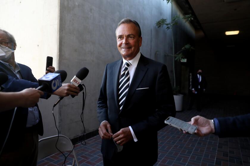 LOS ANGELES, CA - FEBRUARY 11: Rick Caruso meets the press after filing paper work to run for mayor of Los Angeles at the city clerks office at the Piper Tech building in downtown on Friday, Feb. 11, 2022 in Los Angeles, CA. (Gary Coronado / Los Angeles Times)