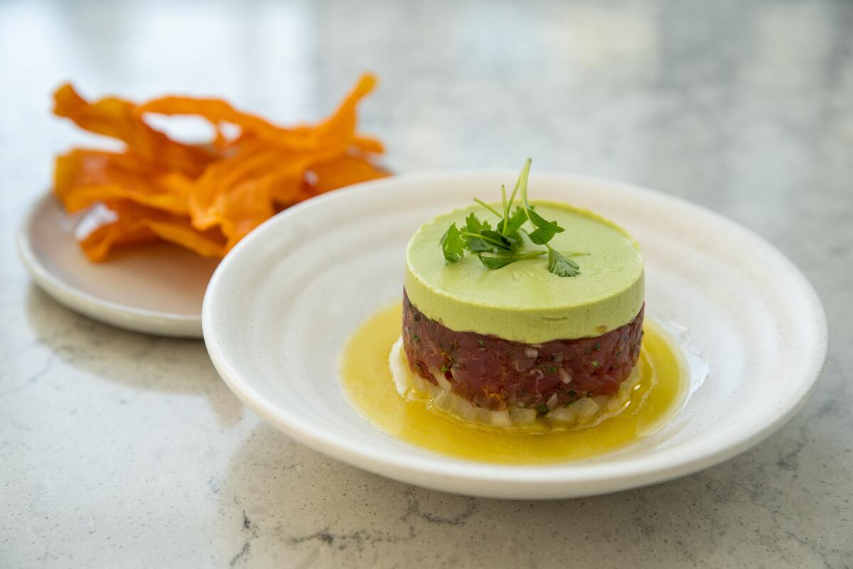 Ahi tuna tartare with avocado and cucumber yuzu served with sweet potato chips at Openaire