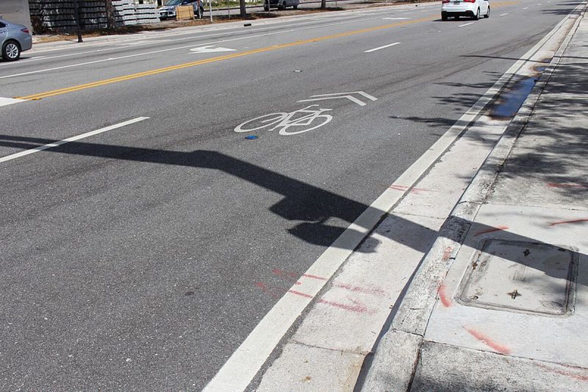 An example of a sharrow painted on a street.