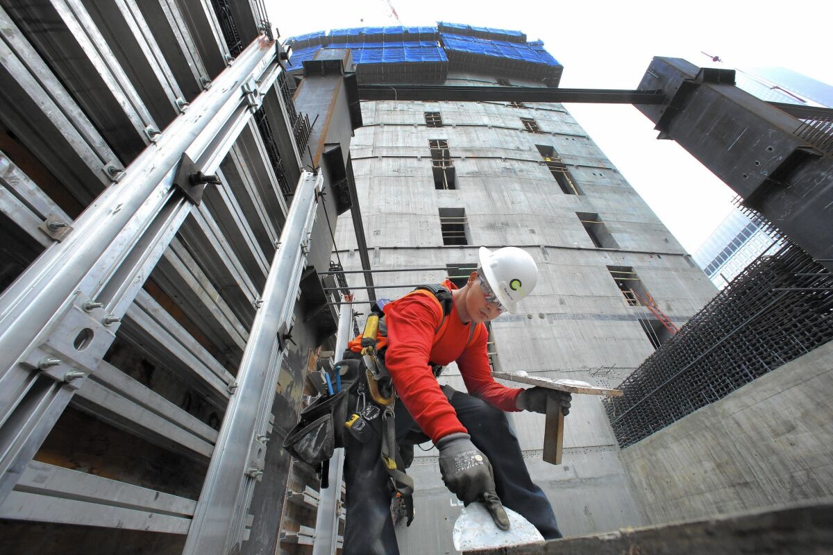 Carpenter Angel Diaz works on the Wilshire Grand Center last year in L.A.