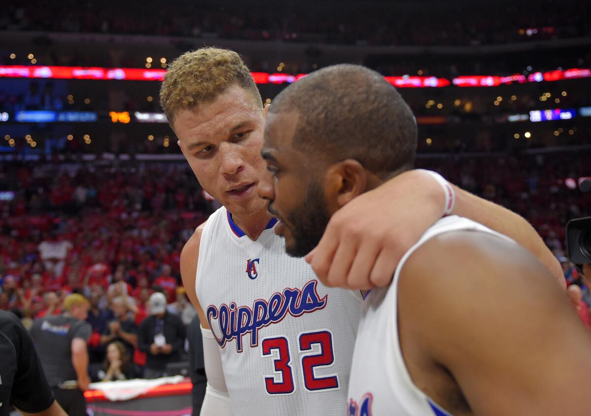 Clippers forward Blake Griffin, left, hugs guard Chris Paul after they defeated the Spurs in a first-round Game 7.