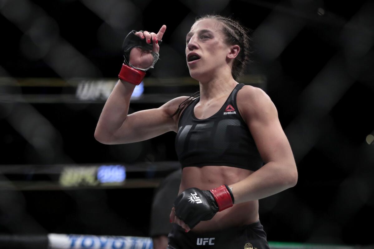 Joanna Jedrzejczyk reacts at the end of her strawweight title fight against Karolina Kowalkiewicz at UFC 205 at Madison Square Garden in New York on November 12, 2016. Jedrzejczyk won by unanimous decision.