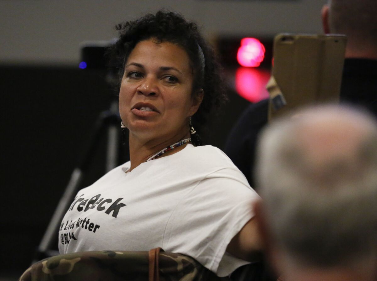 Melina Abdullah, professor and chair of Pan-African Studies at Cal State L.A., and a founding member of Black Lives Matter’s L.A. chapter, at a meeting of the Los Angeles Police Commission during the public comments period in 2017. Her t-shirt says "#Fire Beck."