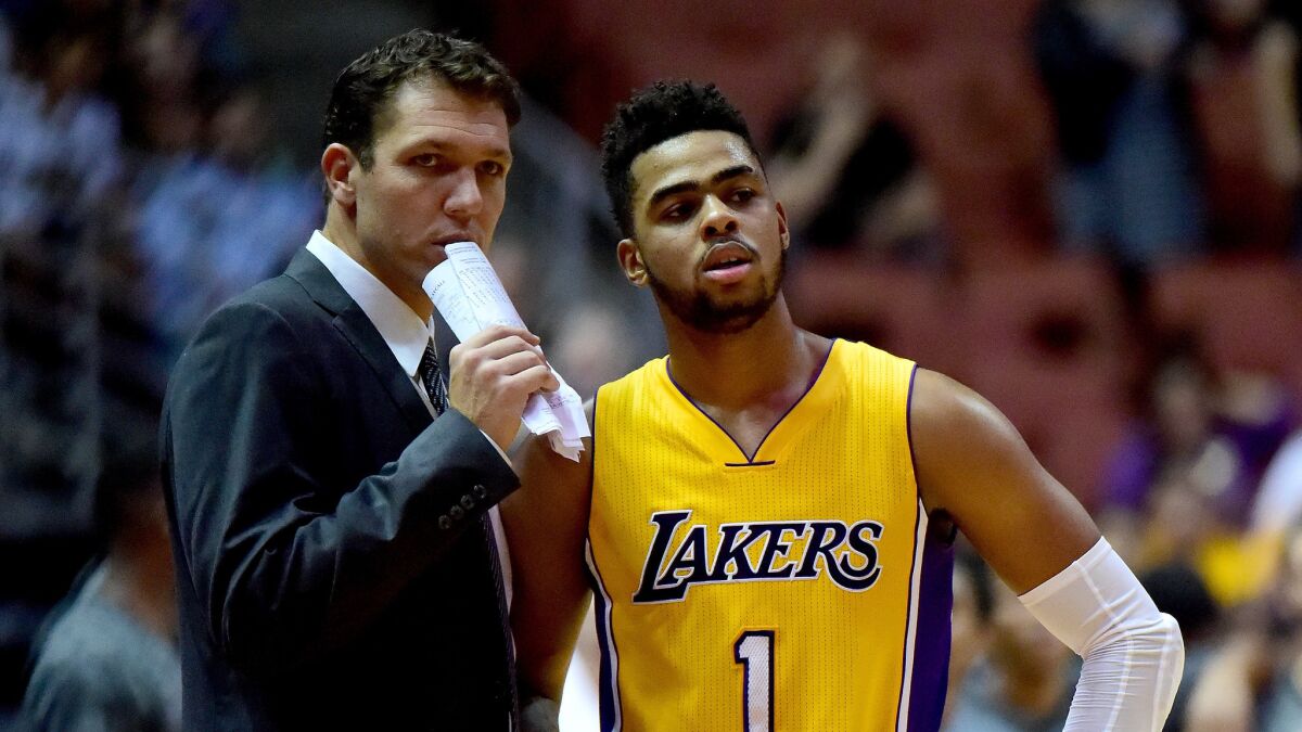 Lakers Coach Luke Walton says D'Angelo Russell, shown during an Oct. 21 game against Phoenix, is "a big part of what we do and we're not going to rush him at all."