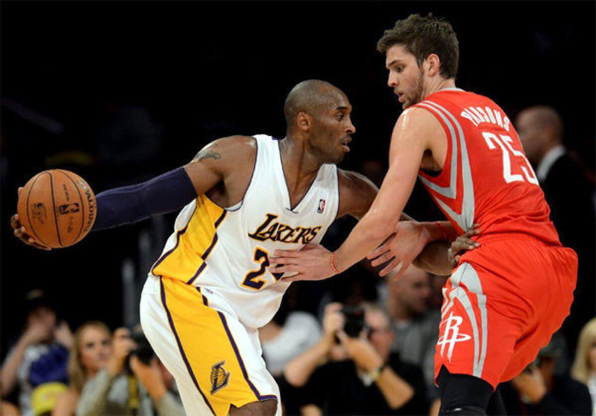 Kobe Bryant racked up 22 points, 11 rebounds and 11 assists against the Rockets on Sunday at Staples Center.