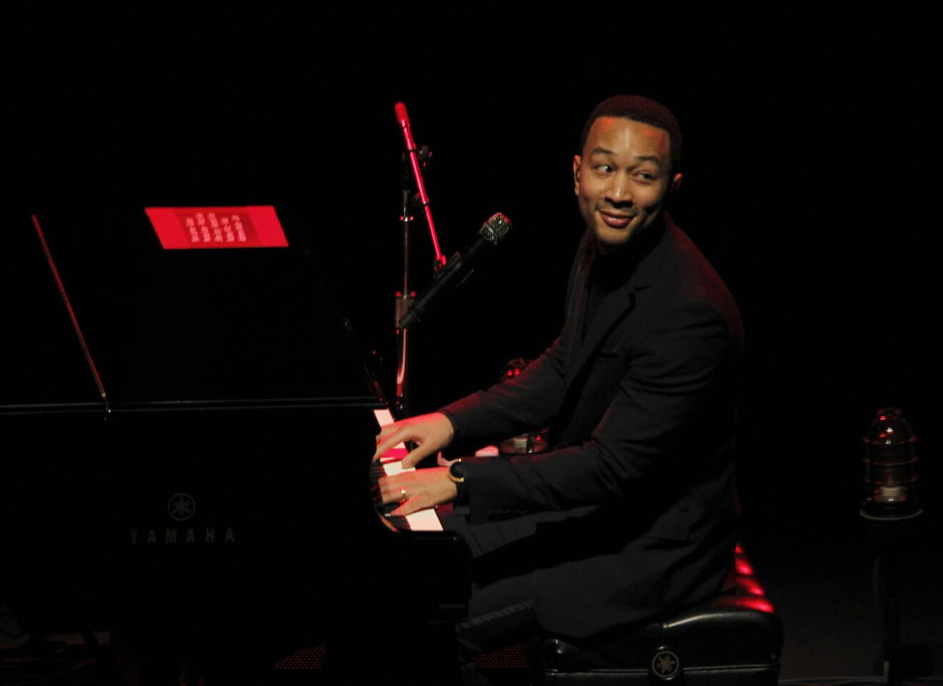John Legend, the R&B singer whose recent work has trended away from civil rights-era soul to more personal, electronic meditations on relationships, oozes charm during his acoustic performance at Walt Disney Concert Hall in Los Angeles on March 26, 2014.