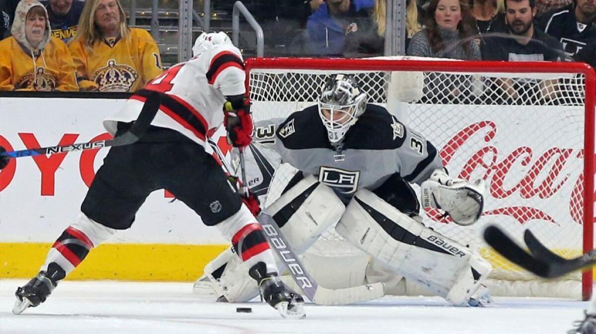 Devils forward Adam Henrique squares off against Kings goaltender Peter Budaj during the second period of a game on Nov. 19.