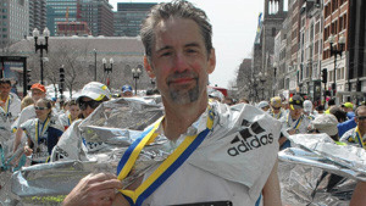 Joe Tanfani shows off Boston Marathon finisher's medal on Boylston Street on April 15, 2013, about a half hour before two pressure cooker bombs exploded.